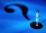 woman standing on question mark